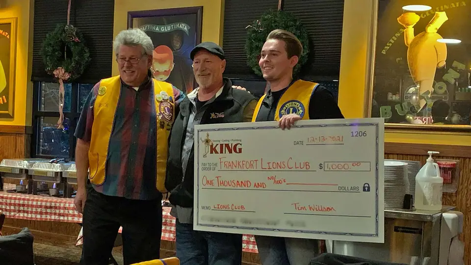King Heating presents a donation check to the local Lions Club, supporting their charitable efforts in the community.