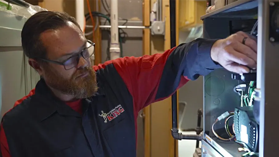A King technician working on a furnace