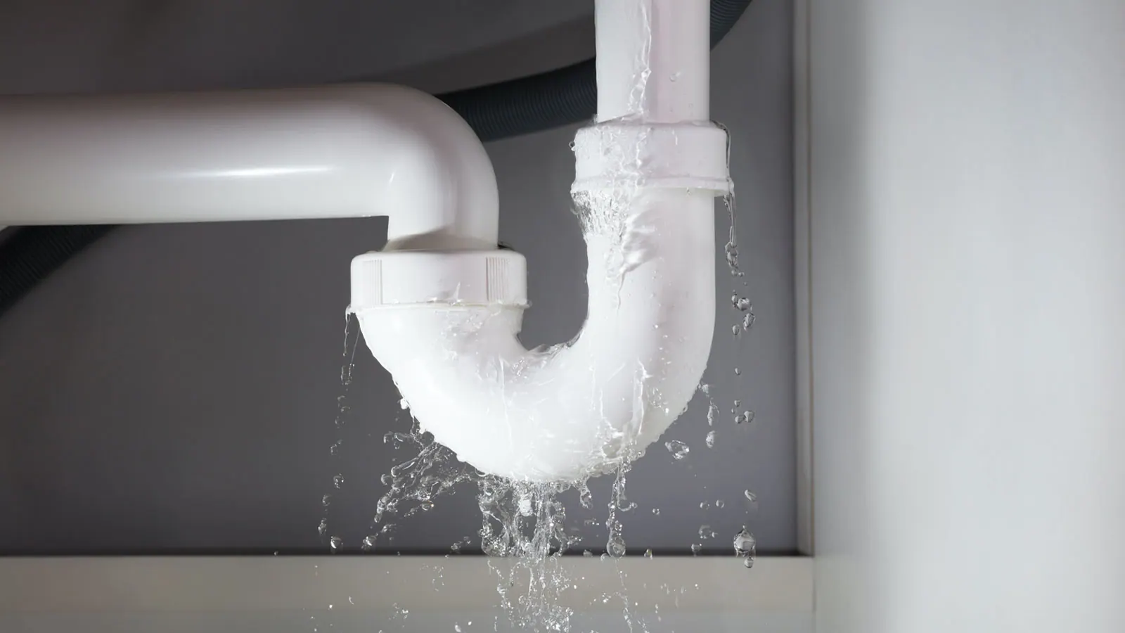 A plumber using leak detection equipment