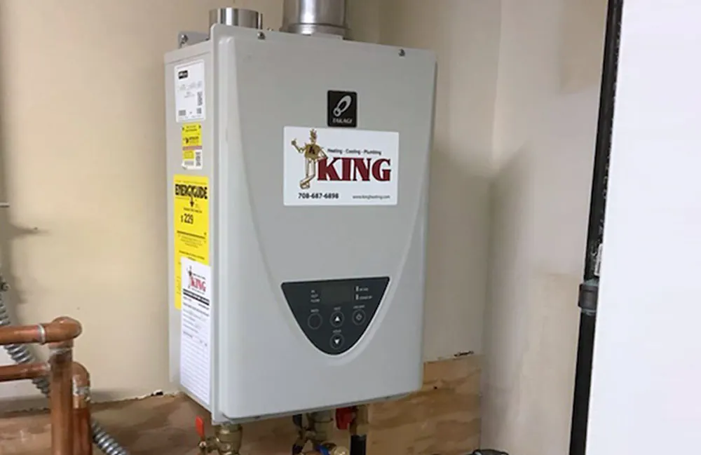A King plumber delivering a new tankless water heater