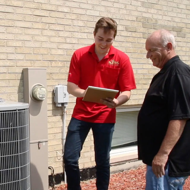 A King tech provides a homeowner with an update about their repaired air conditioner and what they can expect moving forward.