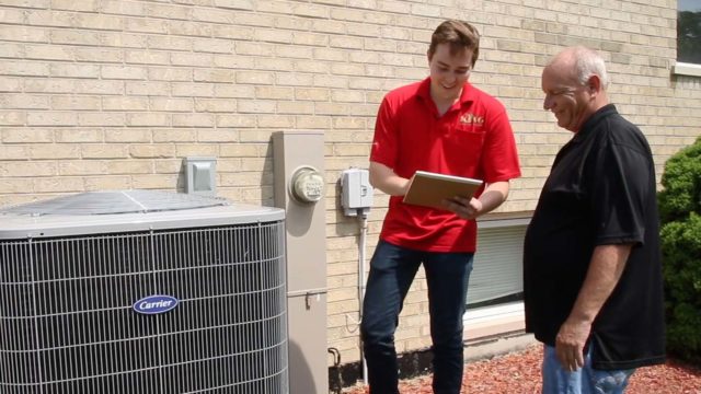 A King tech provides a homeowner with an update about their repaired air conditioner and what they can expect moving forward.